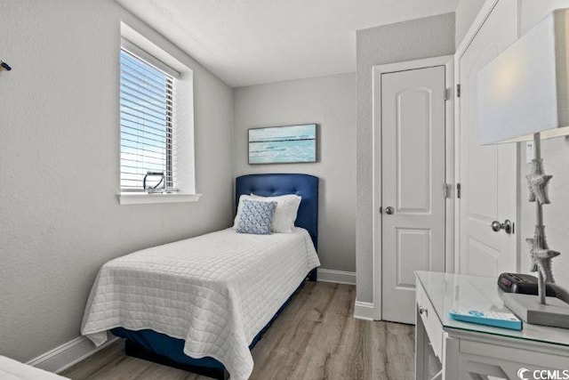 bedroom featuring hardwood / wood-style flooring