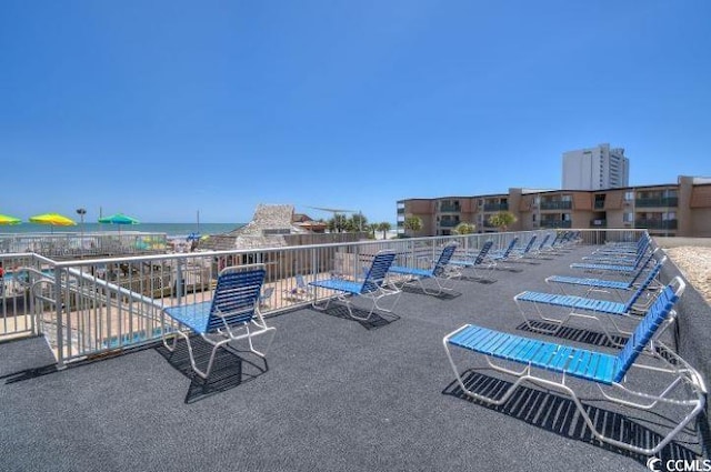 view of patio featuring a water view