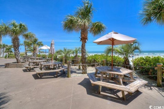 view of patio featuring a water view