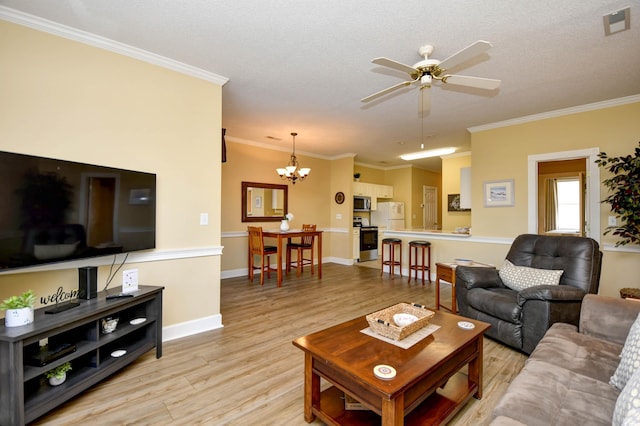 living room with light hardwood / wood-style flooring, crown molding, ceiling fan with notable chandelier, and a textured ceiling