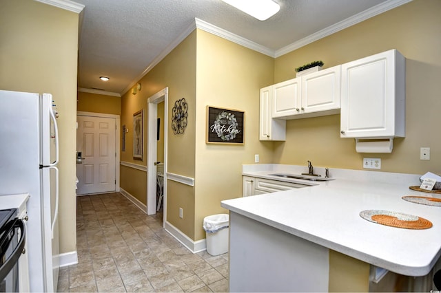 kitchen featuring light tile floors, range, sink, white cabinetry, and crown molding