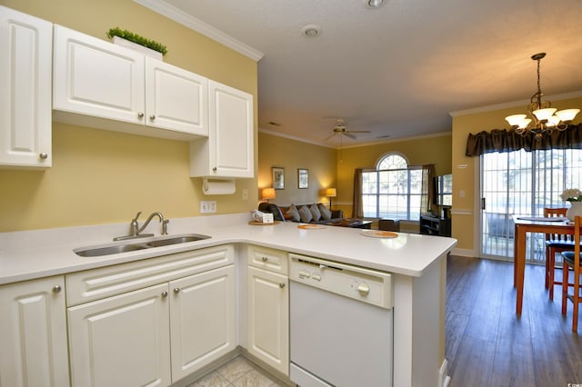 kitchen featuring sink, light hardwood / wood-style floors, kitchen peninsula, and dishwasher