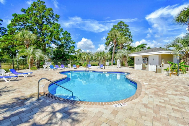 view of swimming pool featuring a patio