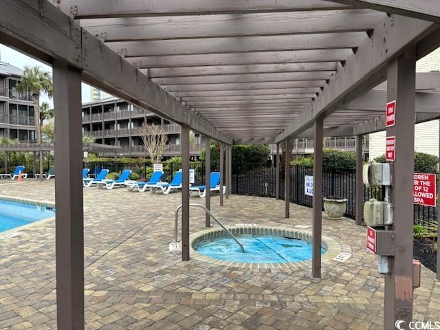 212 2nd Ave N Unit 362, North Myrtle Beach, SC 29582 - pool featuring fence, a patio, a hot tub, and a pergola