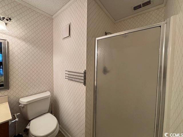 bathroom featuring ornamental molding, a shower with door, toilet, and vanity