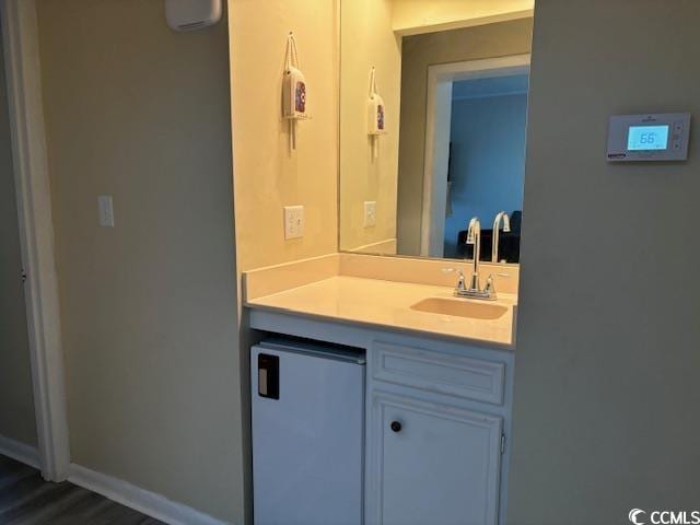 212 2nd Ave N Unit 362, North Myrtle Beach, SC 29582 - bathroom featuring vanity, baseboards, and wood finished floors