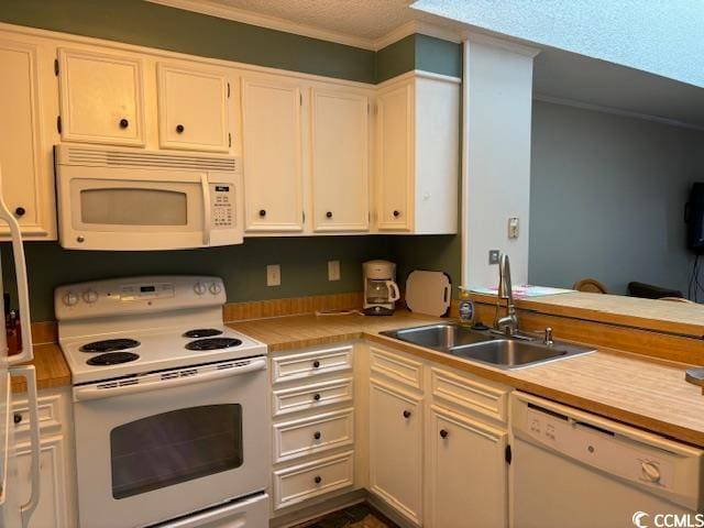 kitchen with sink, white appliances, white cabinetry, and a textured ceiling