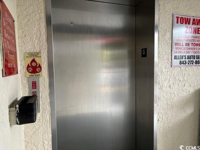 212 2nd Ave N Unit 362, North Myrtle Beach, SC 29582 - room details featuring a textured wall and elevator