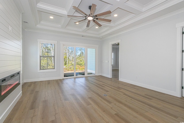 unfurnished living room featuring light wood-type flooring, beamed ceiling, and coffered ceiling