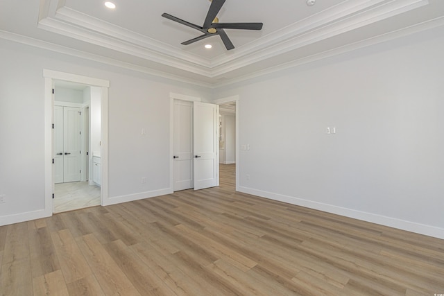 unfurnished bedroom with ornamental molding, light wood-type flooring, baseboards, and recessed lighting