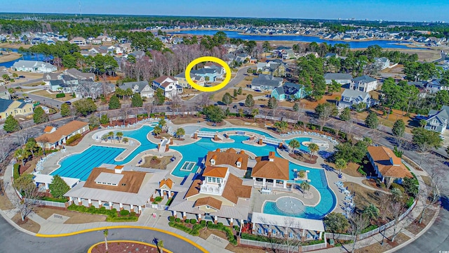 bird's eye view featuring a water view and a residential view