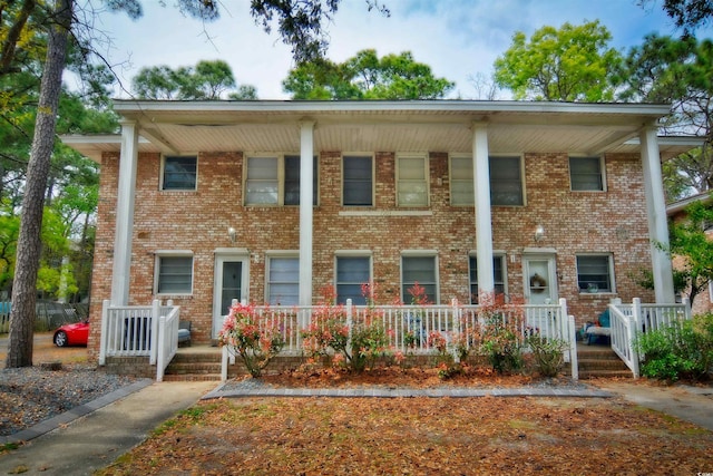 multi unit property featuring a porch