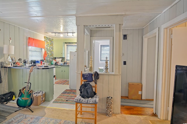 interior space featuring rail lighting and hardwood / wood-style floors