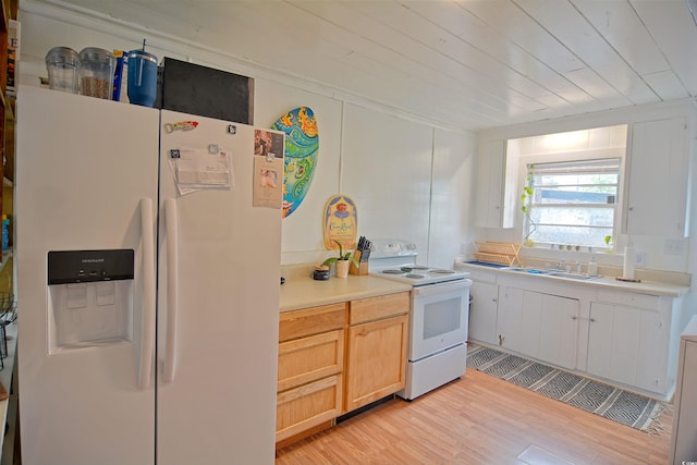 kitchen with light brown cabinetry, white appliances, light hardwood / wood-style floors, and sink