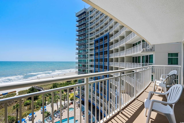 balcony featuring a water view