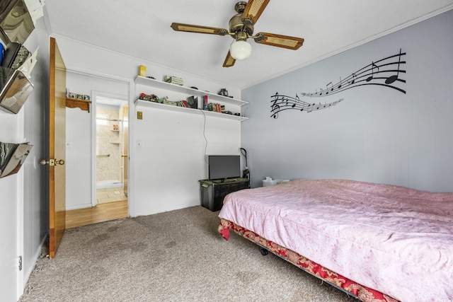 carpeted bedroom featuring ceiling fan and crown molding