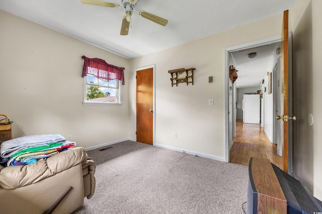 sitting room featuring carpet flooring and ceiling fan