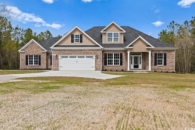 craftsman house featuring a garage and a front yard