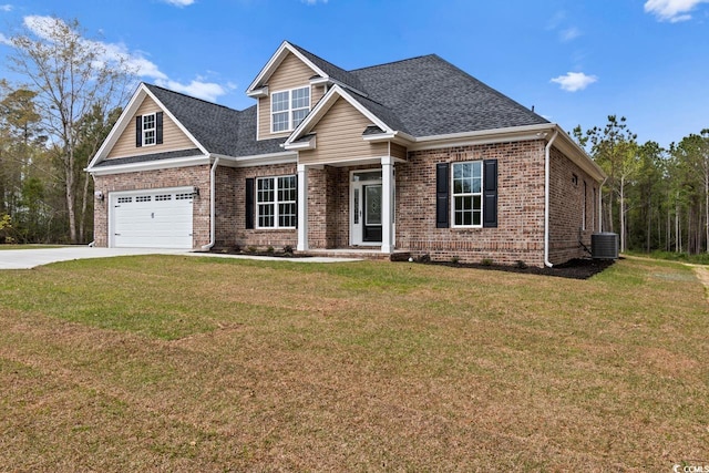 craftsman-style house featuring central AC unit, a garage, and a front yard