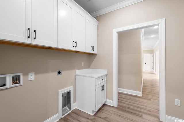 laundry area with cabinets, crown molding, washer hookup, electric dryer hookup, and light wood-type flooring