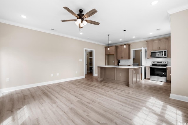 kitchen featuring hanging light fixtures, backsplash, appliances with stainless steel finishes, light hardwood / wood-style floors, and ceiling fan