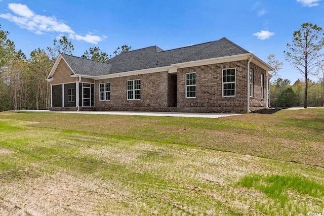 rear view of property with a patio area and a yard