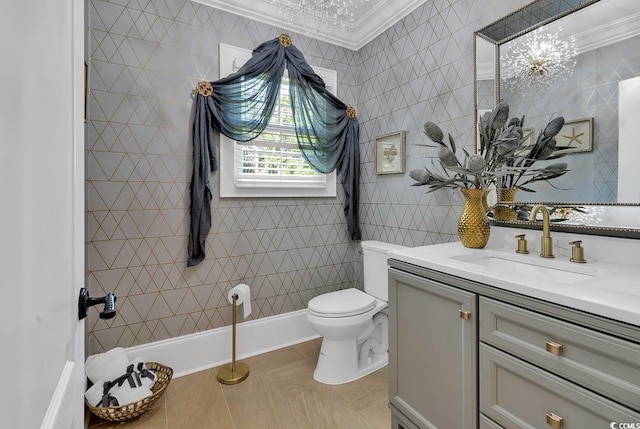 bathroom with toilet, vanity, ornamental molding, and tile walls