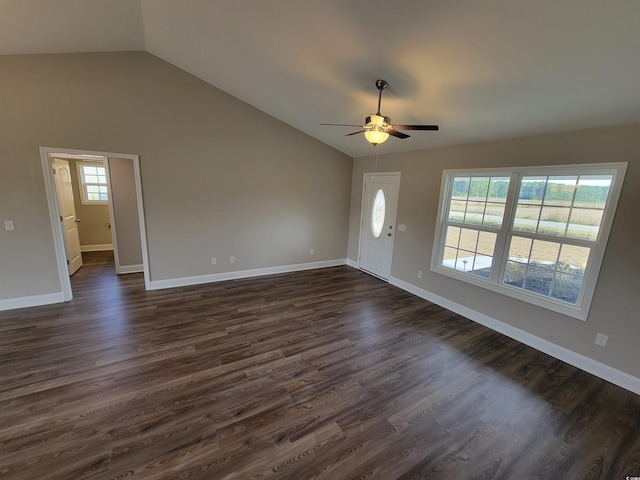 entrance foyer featuring dark wood finished floors, lofted ceiling, and baseboards