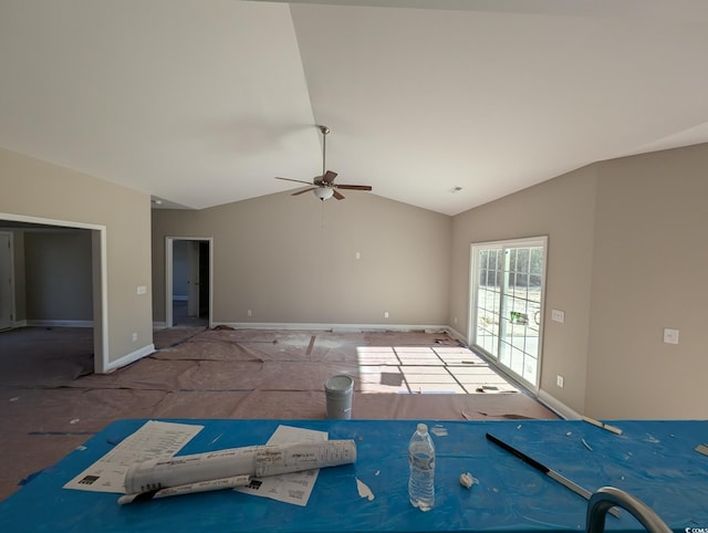 empty room with ceiling fan and lofted ceiling