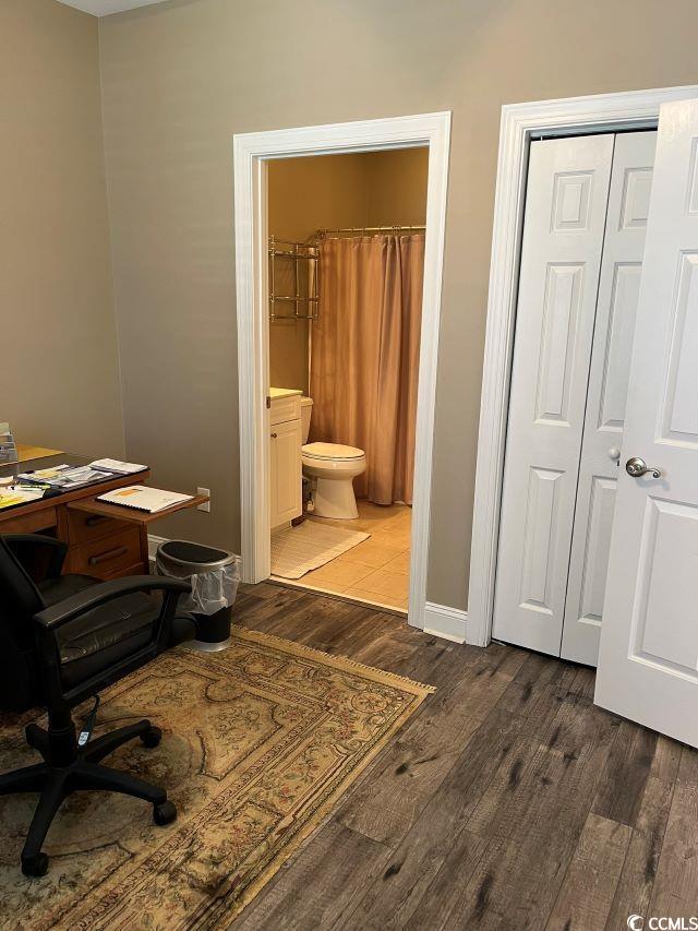 home office featuring dark hardwood / wood-style flooring