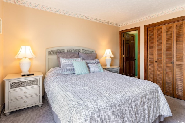 bedroom with a closet and carpet floors