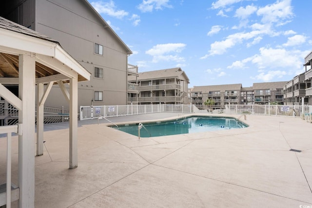 view of pool featuring a patio