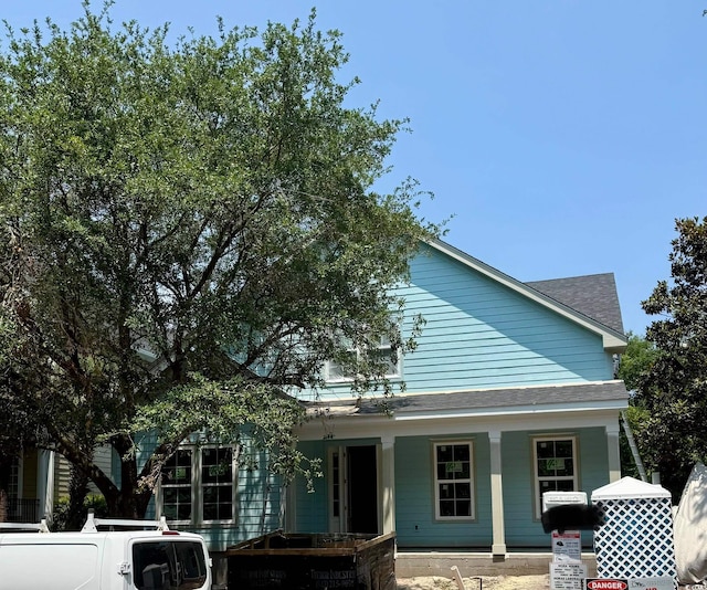 1521 James Island Dr, North Myrtle Beach, SC 29582 - view of front of house with covered porch and a shingled roof