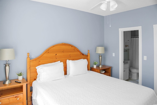 bedroom featuring ceiling fan and ensuite bathroom