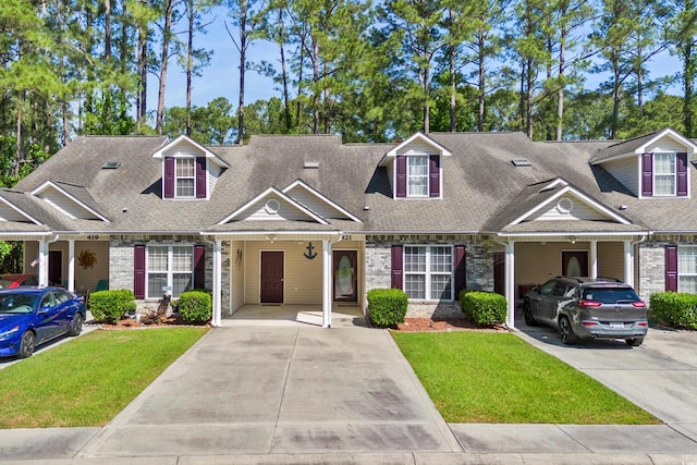 view of front facade with a front lawn and a carport