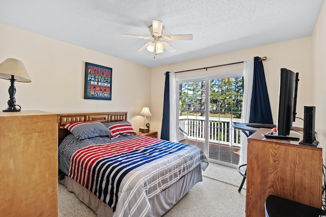 carpeted bedroom featuring a textured ceiling, ceiling fan, and access to exterior