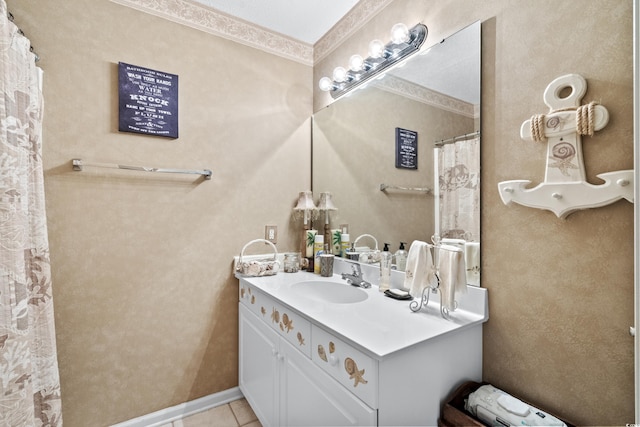 bathroom featuring tile flooring, vanity with extensive cabinet space, and crown molding