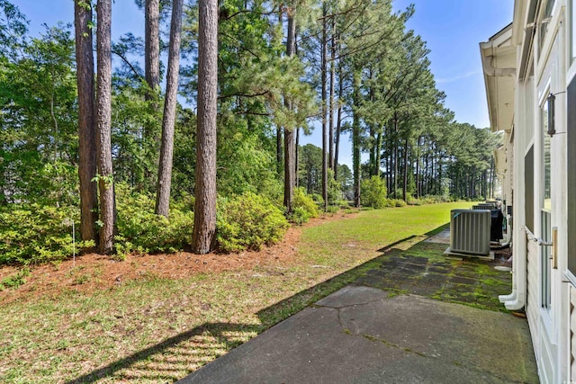 view of yard featuring a patio area and central AC unit