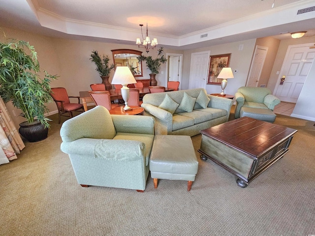 living room with an inviting chandelier, carpet floors, crown molding, and a raised ceiling