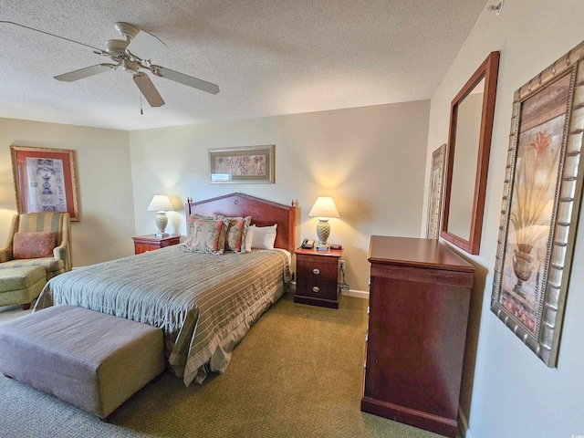 bedroom featuring ceiling fan, carpet, and a textured ceiling