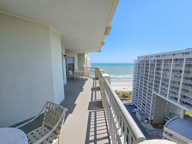 balcony featuring a water view