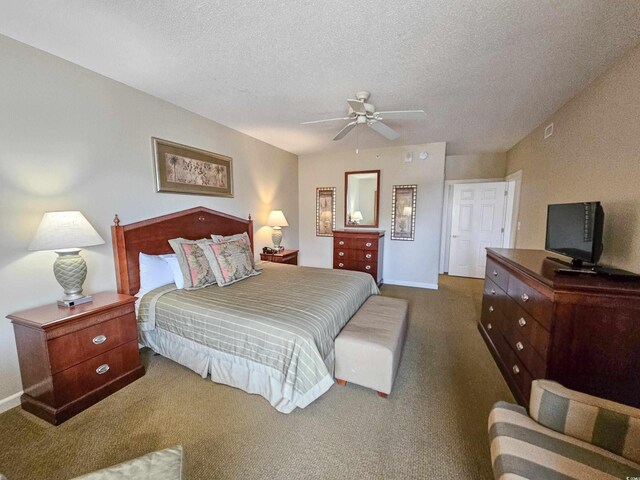 carpeted bedroom with a textured ceiling and ceiling fan