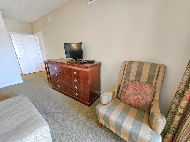 carpeted bedroom featuring a textured ceiling