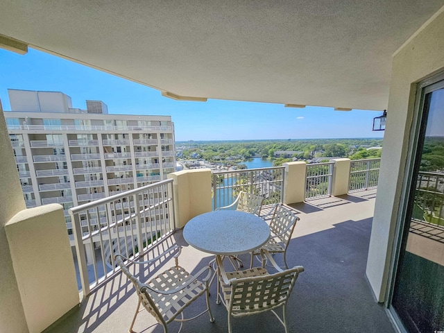 balcony featuring a water view