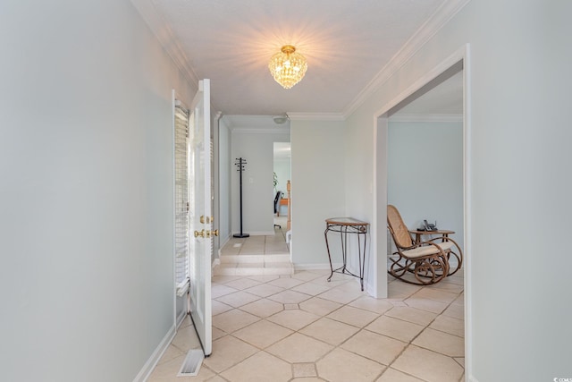 corridor featuring a notable chandelier, light tile floors, and ornamental molding