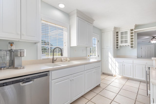 kitchen with white cabinets, sink, ceiling fan, and stainless steel dishwasher