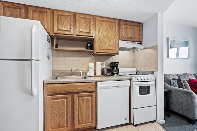 kitchen with decorative backsplash, extractor fan, light tile patterned flooring, sink, and white appliances