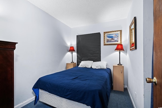 carpeted bedroom with a textured ceiling