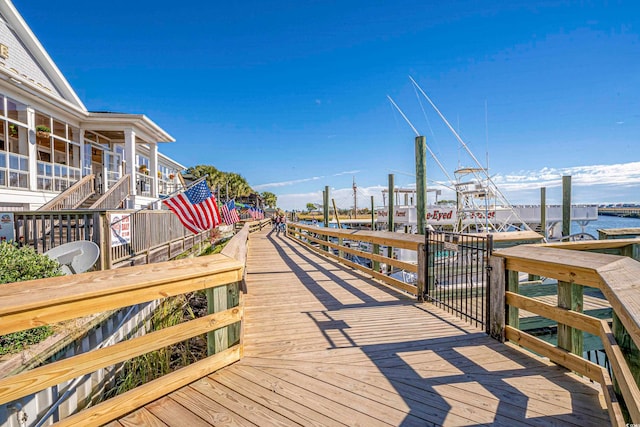 exterior space featuring a dock and a water view