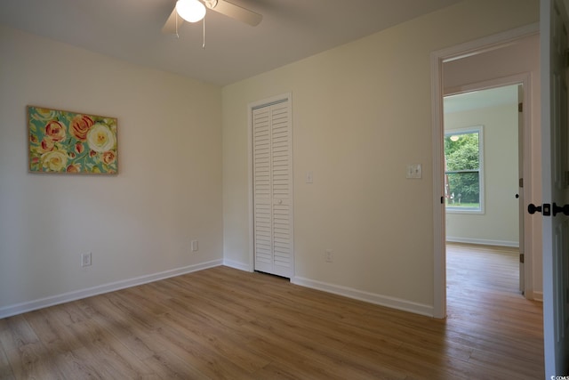 unfurnished room featuring ceiling fan and light hardwood / wood-style floors